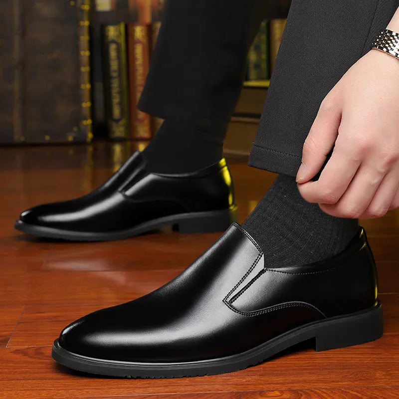 Men's black genuine leather slip-on loafers with a rubber sole and leather toe cap.