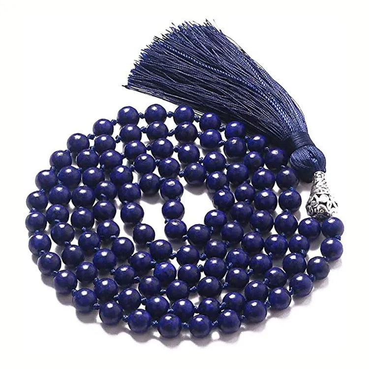 Long beaded agate necklace with geometric stones and a tassel, showing colourful variations.