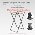 Black folding iron outdoor trash rack with a wooden handle holding a waste bag.
