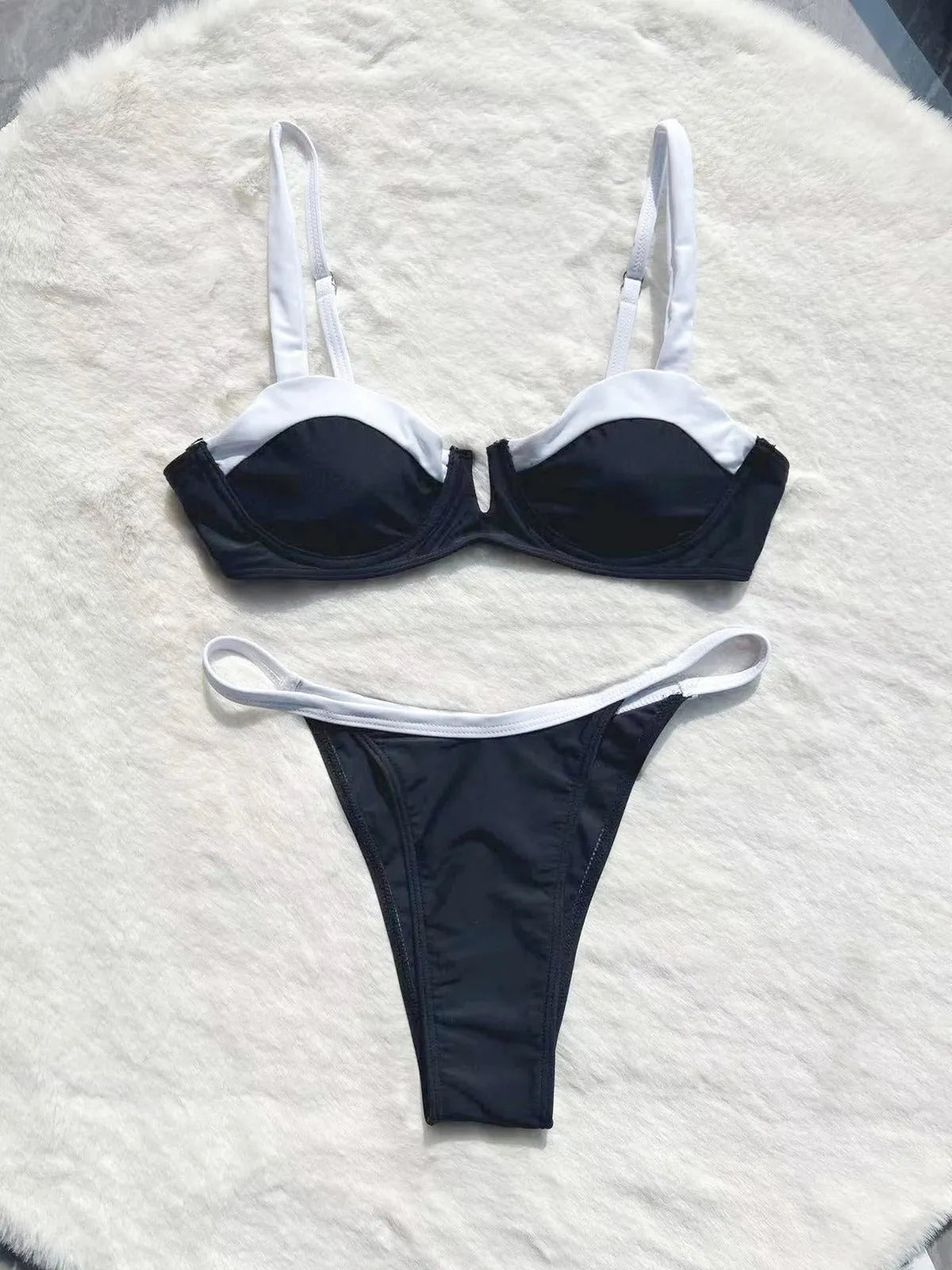 Black low waist women's bikini swimsuit with stitching detail and split design