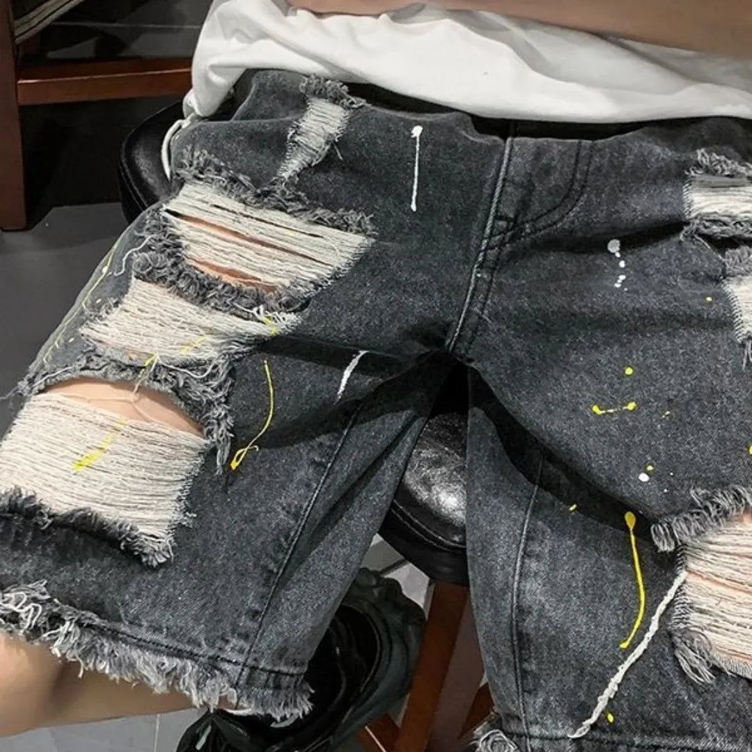 Men's water washed hole denim shorts in black and light blue colours showing loose street style fit