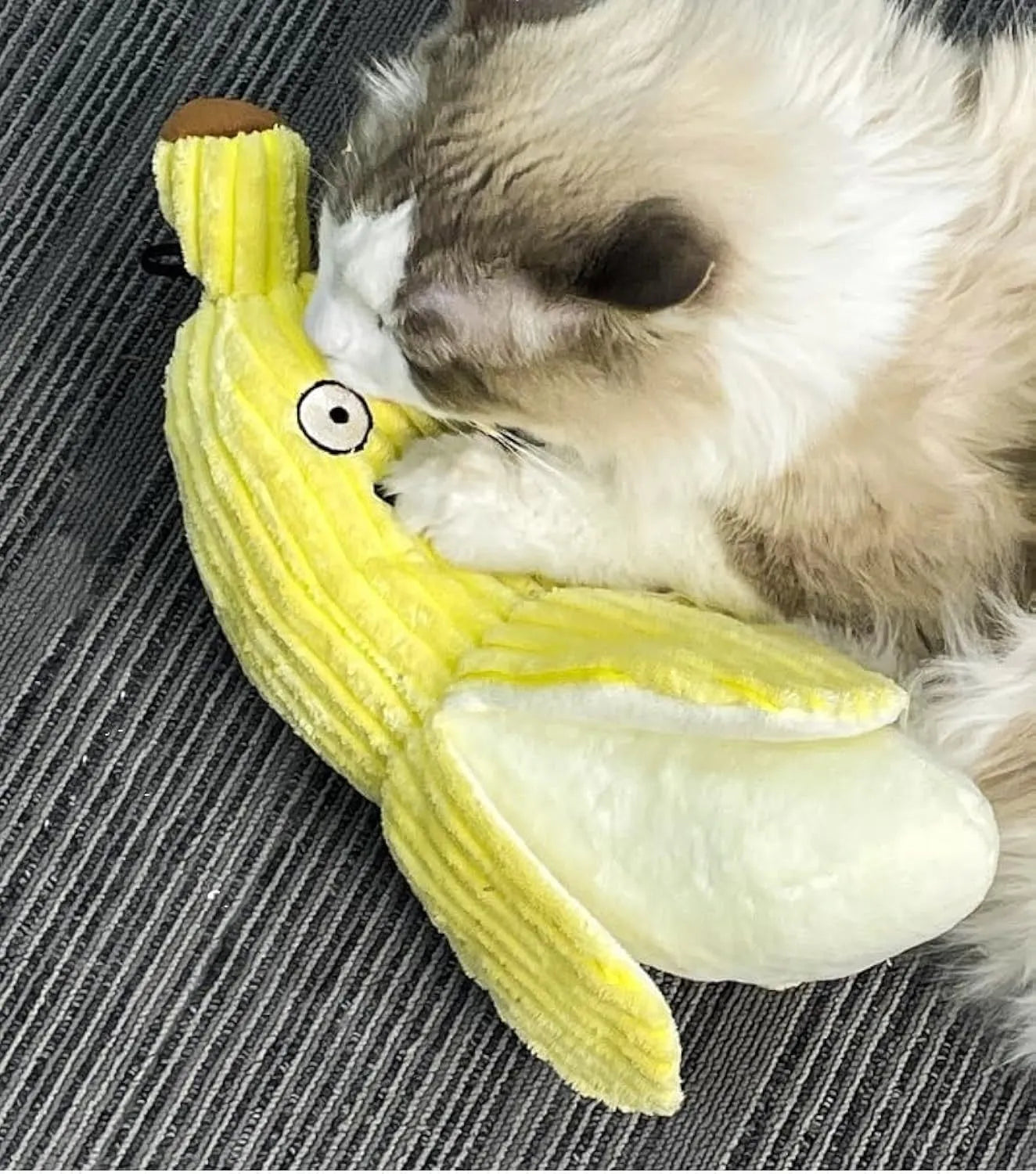 Yellow banana-shaped cat crinkle toy with plush fabric and velvet strip detailing