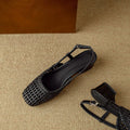 Women's beige woven square-toe sandals with a belt buckle and chunky heel on a white background.