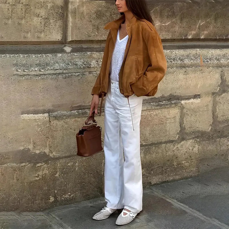 Man wearing a solid colour retro-style loose-fit polyester jacket.