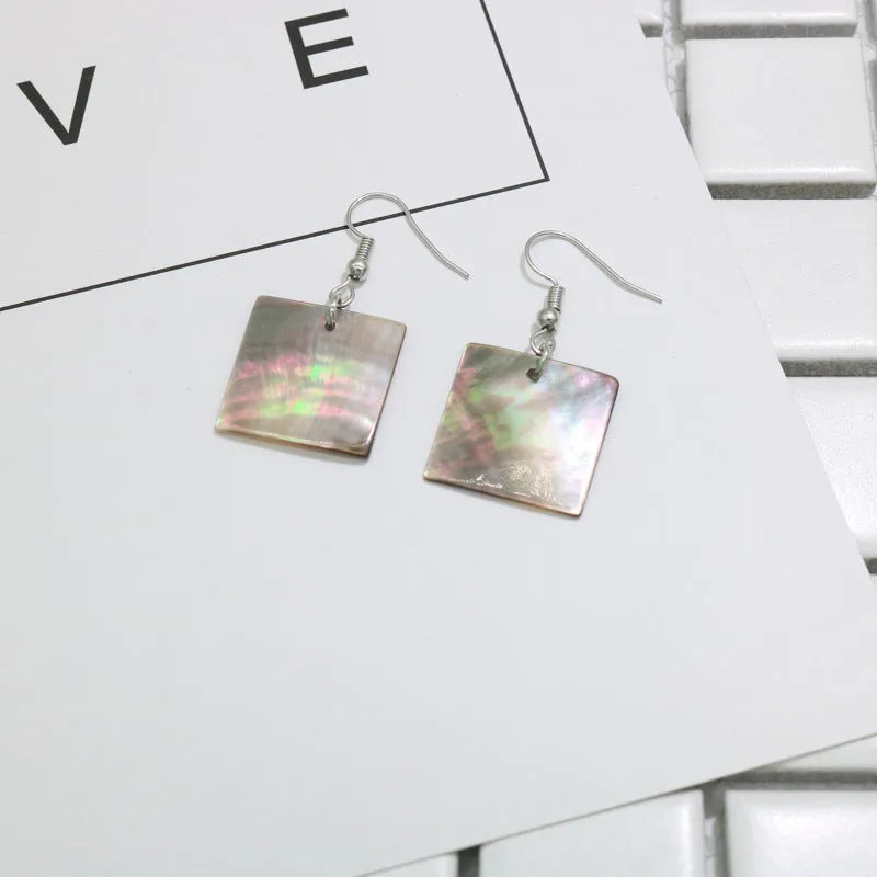 Women's geometric shell earrings in Square Panther and Rectangular Shell colours with retro natural styling