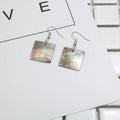 Women's geometric shell earrings in Square Panther and Rectangular Shell colours with retro natural styling