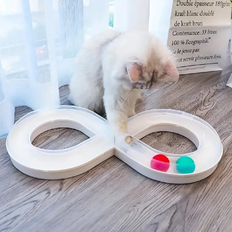 Blue and white cat turntable toy set with track balls and a feather teaser stick on a plain background.