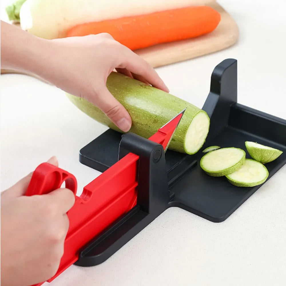 Green and red plastic vegetable cutter with stainless steel blades for carrots and potatoes