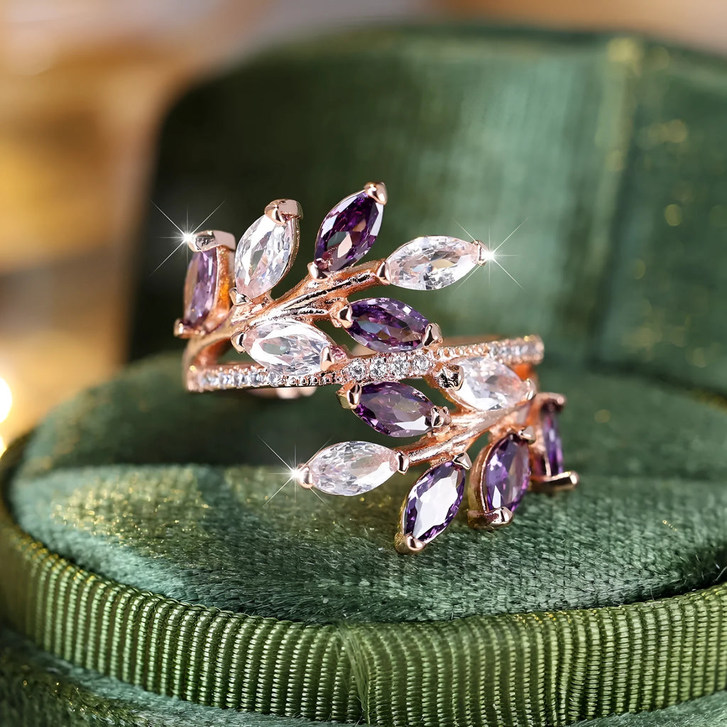 Adjustable horse eye zircon leaf ring in rose gold or platinum plating on a model's hand.