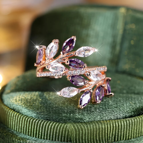 Adjustable horse eye zircon leaf ring in rose gold or platinum plating on a model's hand.