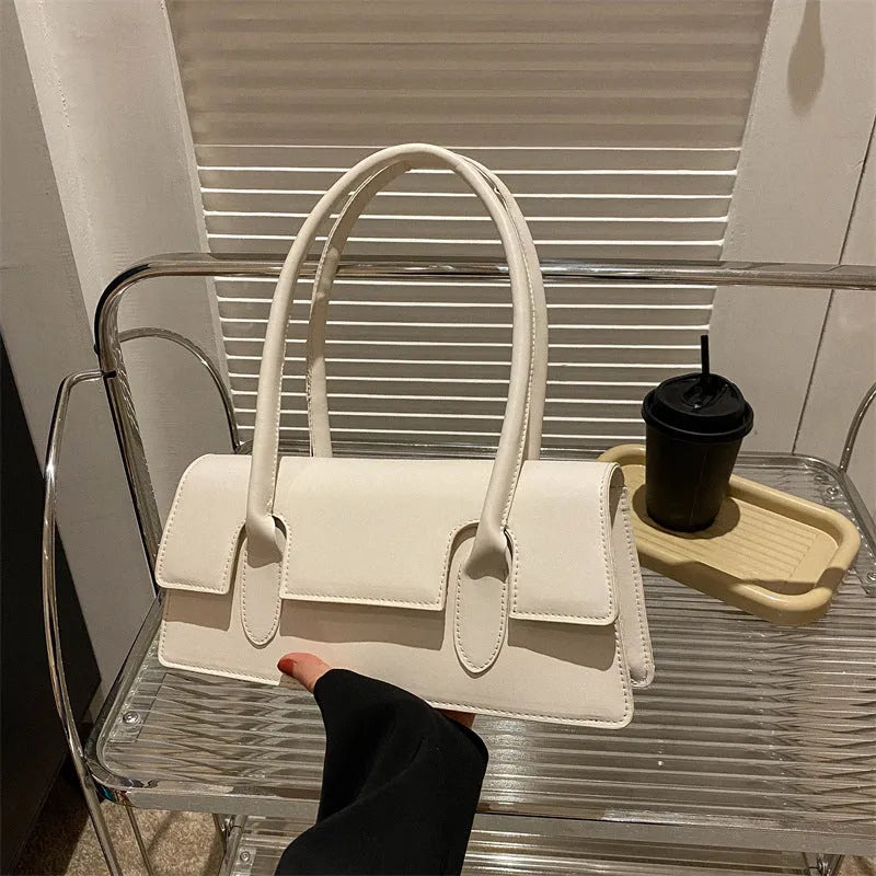 Women's small square shoulder bag in PU leather with stitching details and single strap