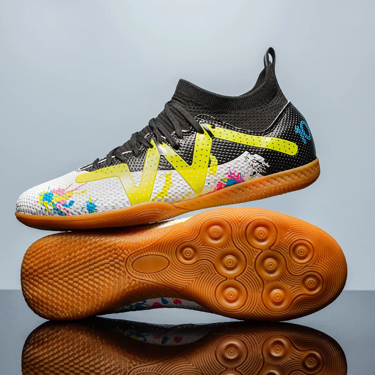 Low-top men's football boots in black and yellow with a PVC upper and rubber studded outsole.