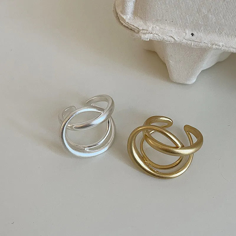 Women's matte metal open ring with three-dimensional interlaced geometric design in gold or silver finish