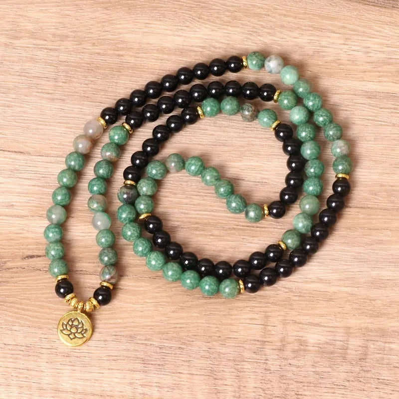 Green and black alloy elastic beaded long bracelet showing stretch design and personality-themed elements