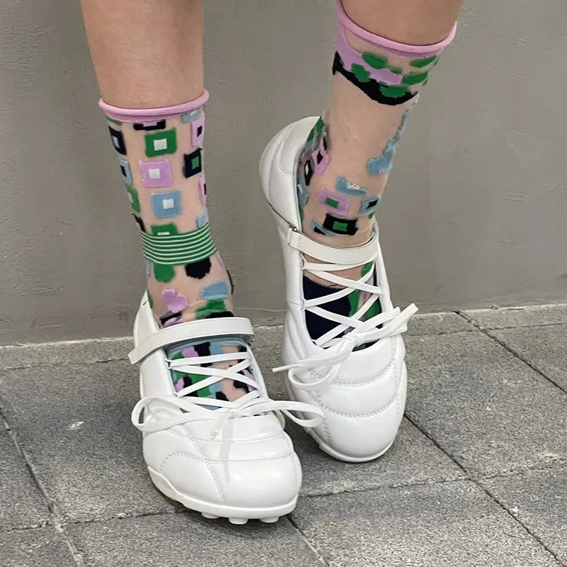 Women's silver sports shoes with lace-up front and decorative bow detail on microfiber upper