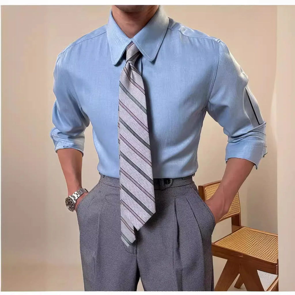 Man wearing a slim fit blue round collar long sleeve shirt made from a rayon and polyester blend.
