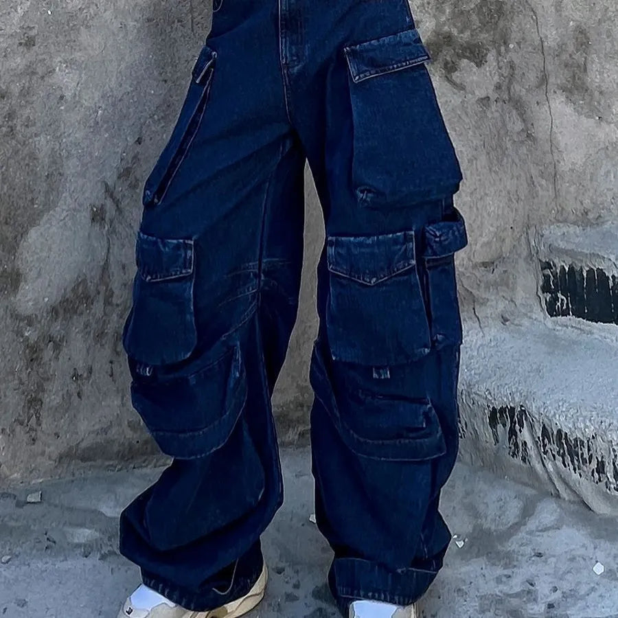 Dark blue distressed wide-leg high-waist jeans with multiple pockets on a mannequin.