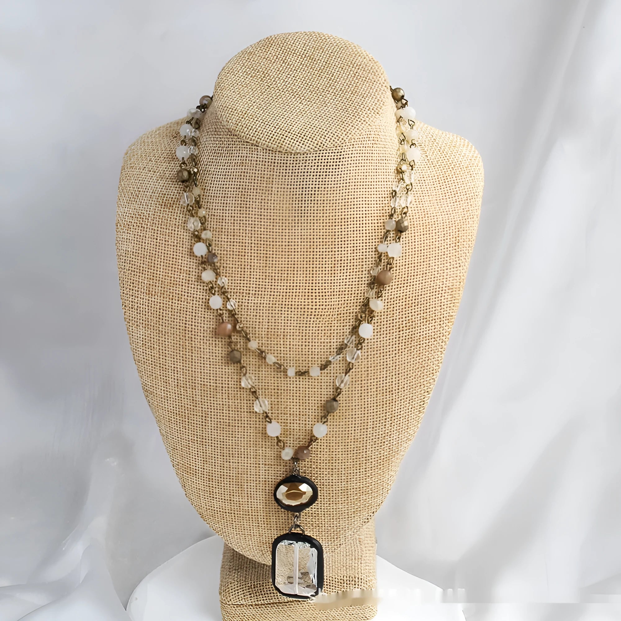 Two-layer tribal-style chain necklace with glass pendant and stone elements in beige and blue colour options
