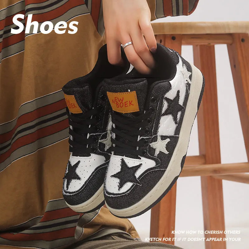 A pair of denim skateboard shoes with a flat rubber sole and lace-up front, shown in a solid colour.