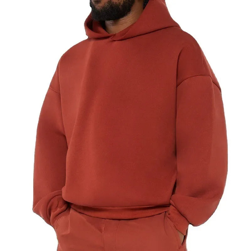 Men's grey fleece-lined cotton pullover hoodie with a wool lining and threaded long sleeves.