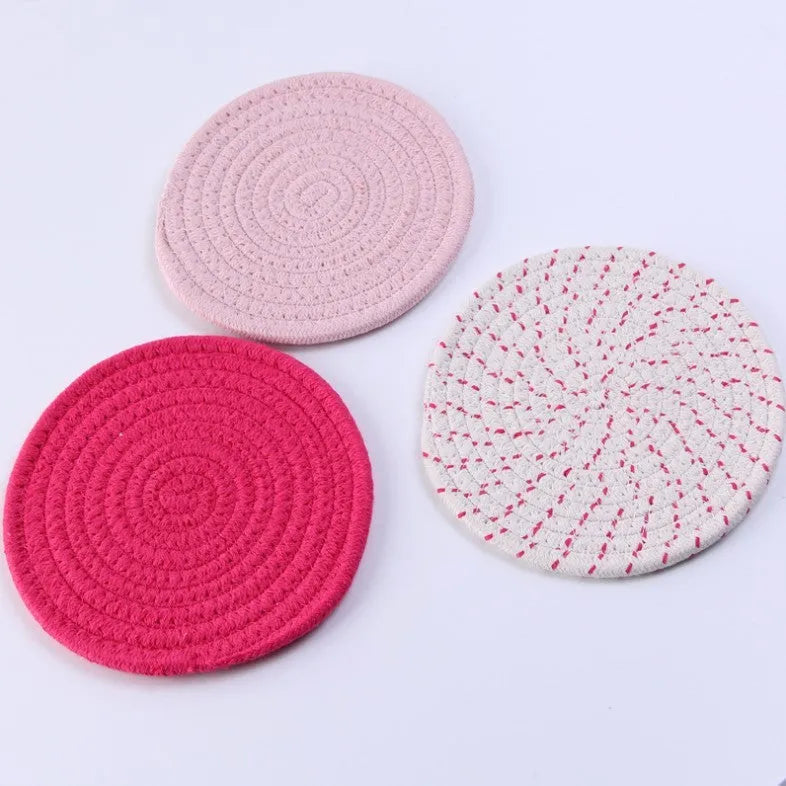 Three round 18cm cotton cord coasters in a set, shown in a blue colour option.