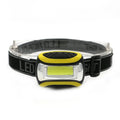 Yellow plastic headlamp with a central COB LED light, shown as a single unit for outdoor use.