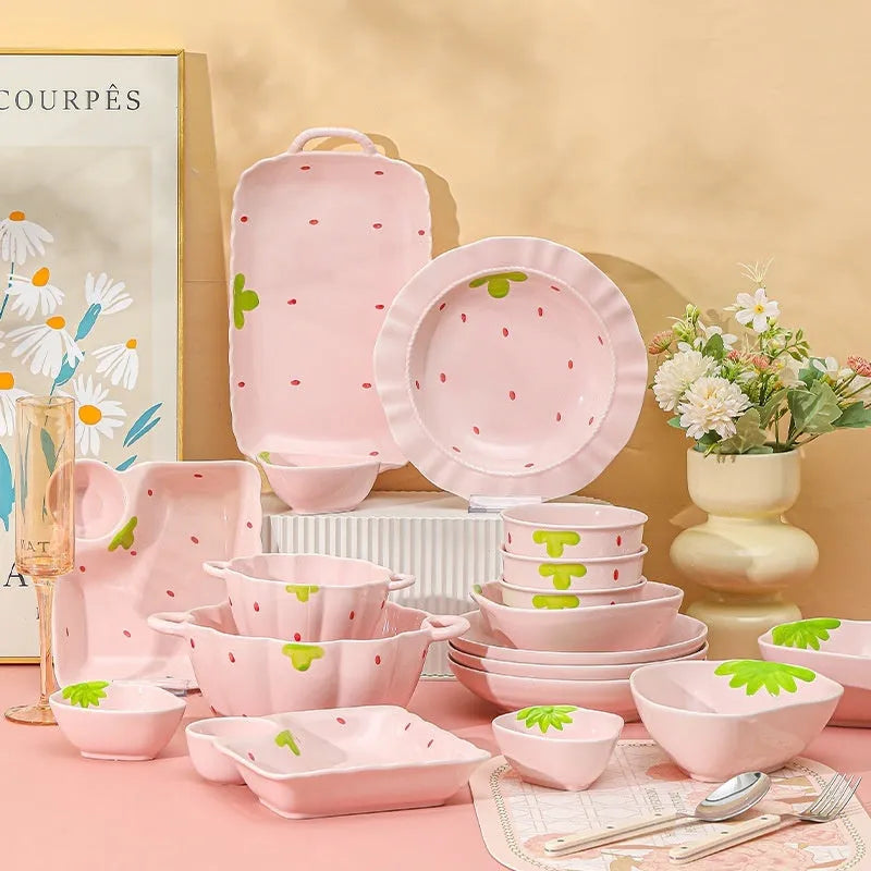 Porcelain dinnerware set with cute strawberry design showing straw hat plate, flower bowl, and twist spoon