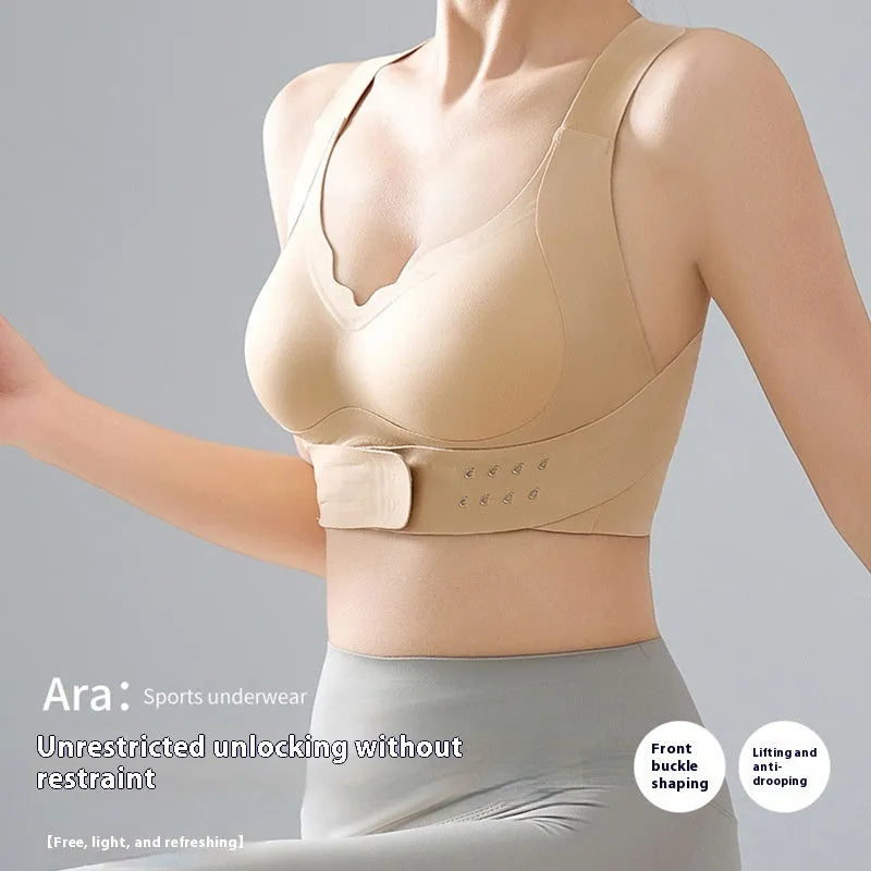 Women's front-fastening yoga sports bra in black, white, or nude with shaping 3/4 cups and double straps.