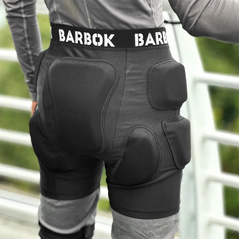 Adult black spandex hip pad pants with built-in protective padding for roller skating and skateboarding.