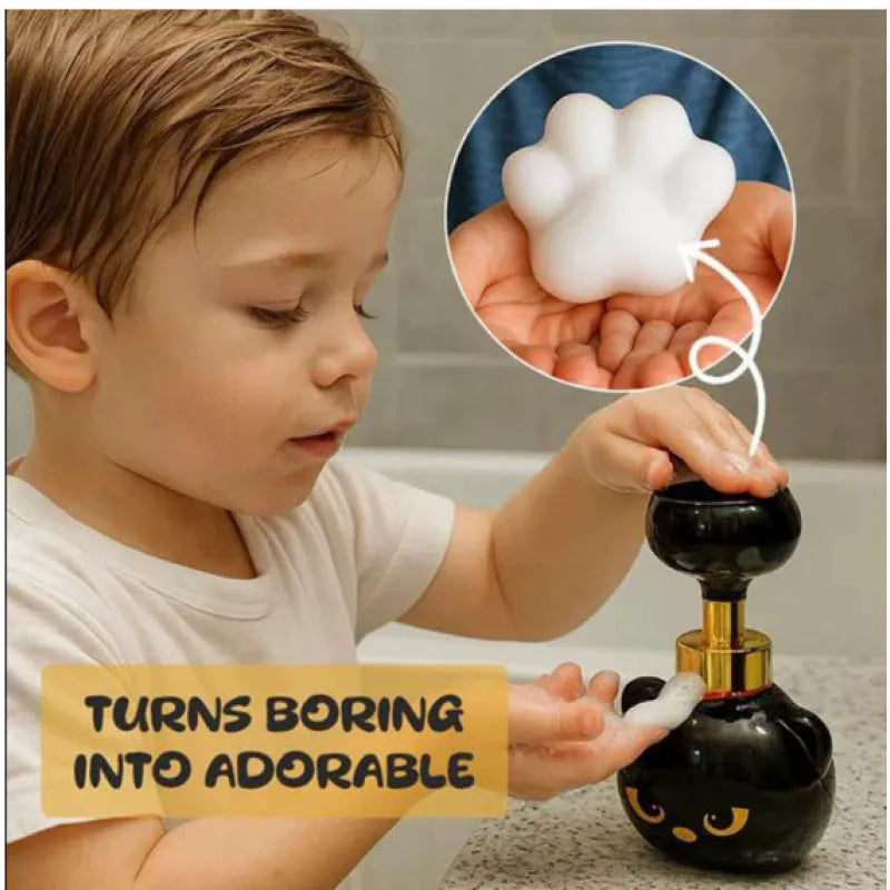 Black cartoon cat shaped plastic foam soap dispenser on bathroom counter