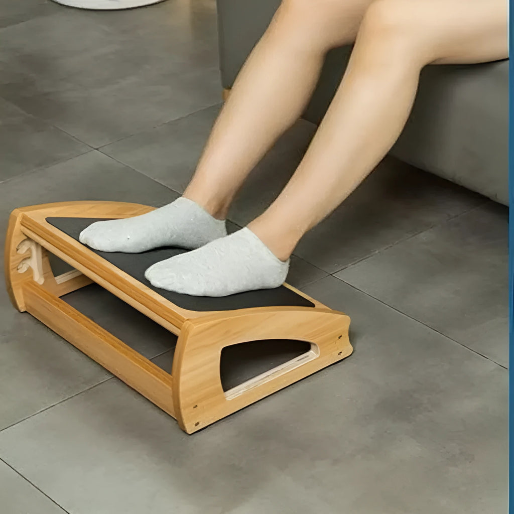 Natural wood colour bamboo adjustable footstool for under a desk.