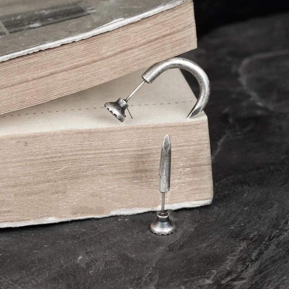 S925 Sterling Silver single nail stud earring on ear hook in straight or curved punk style.