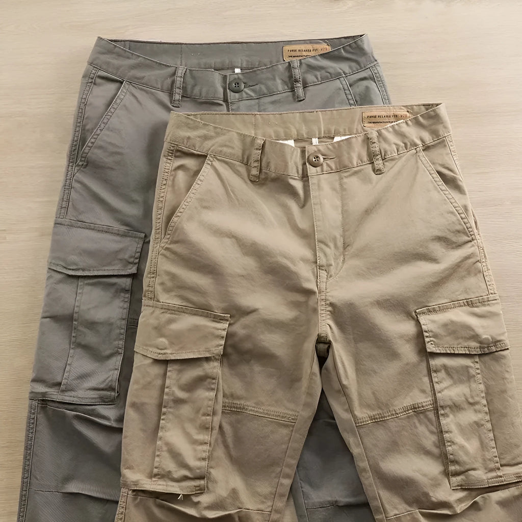 Men's cropped multi-pocket cotton work trousers in khaki, shown on a hanger.