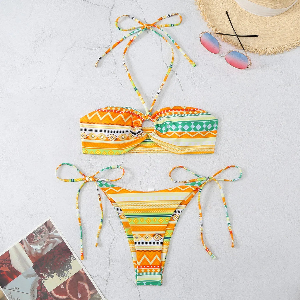Women's green striped halter neck bikini swimsuit with matching briefs on a mannequin