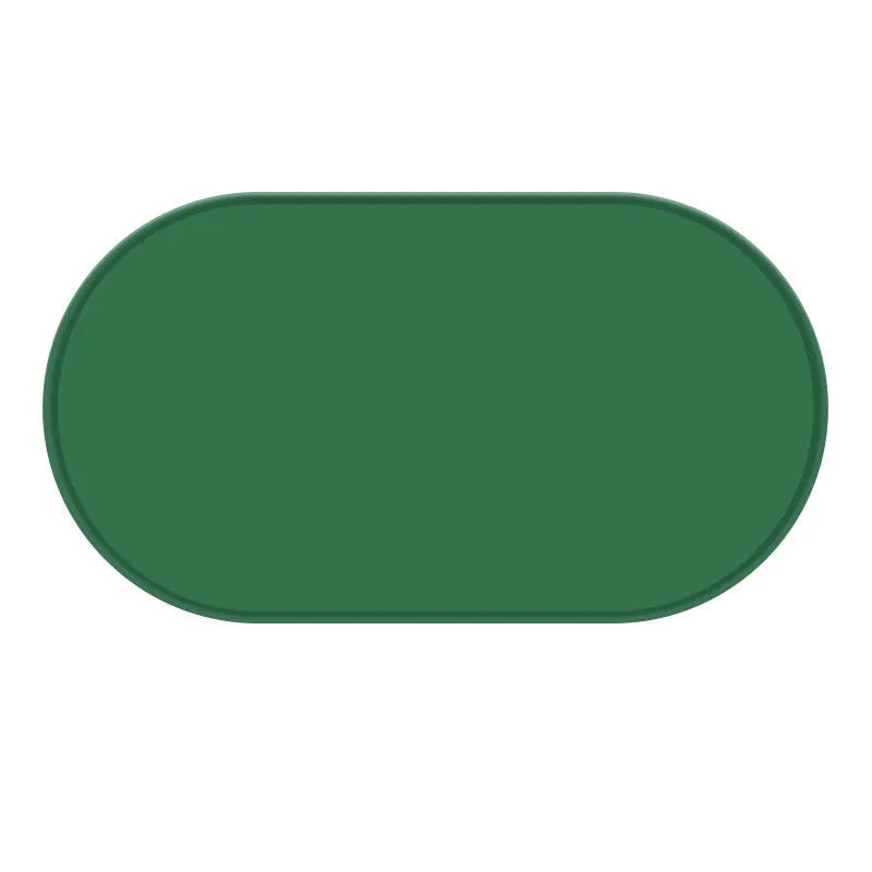 Silicone waterproof cat feeding placemat in green, shown under a food bowl.