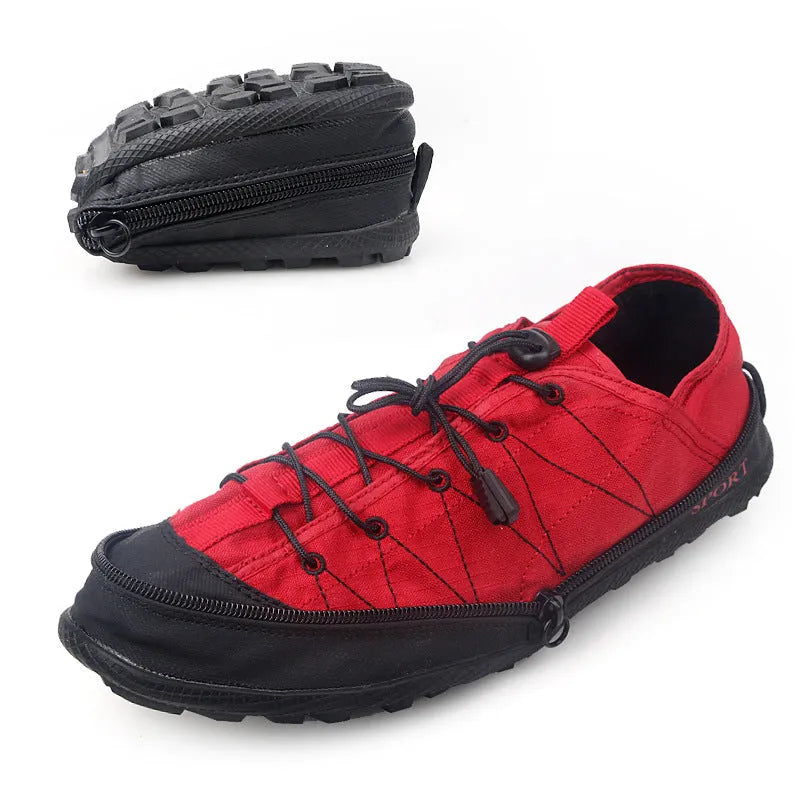 Orange portable folding outdoor shoe with side zipper and mesh upper on a grey background