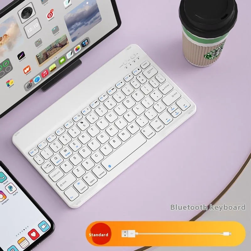 Girls Bluetooth tablet keyboard in multiple colour options including white, green, and pink on a desk