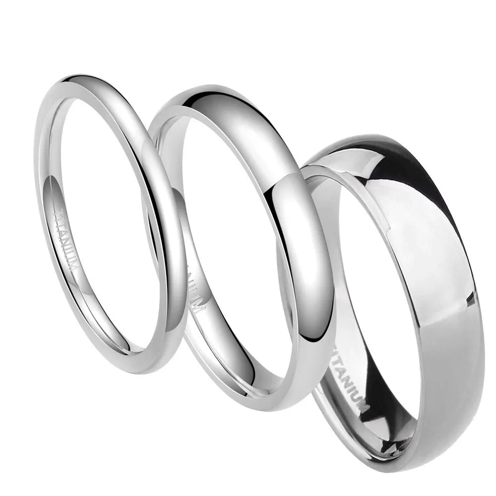 A silver titanium steel ring with a matte grinding finish, shown in different band widths on a plain background.