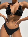 Black women's two-piece bikini swimsuit with gathered design on a mannequin