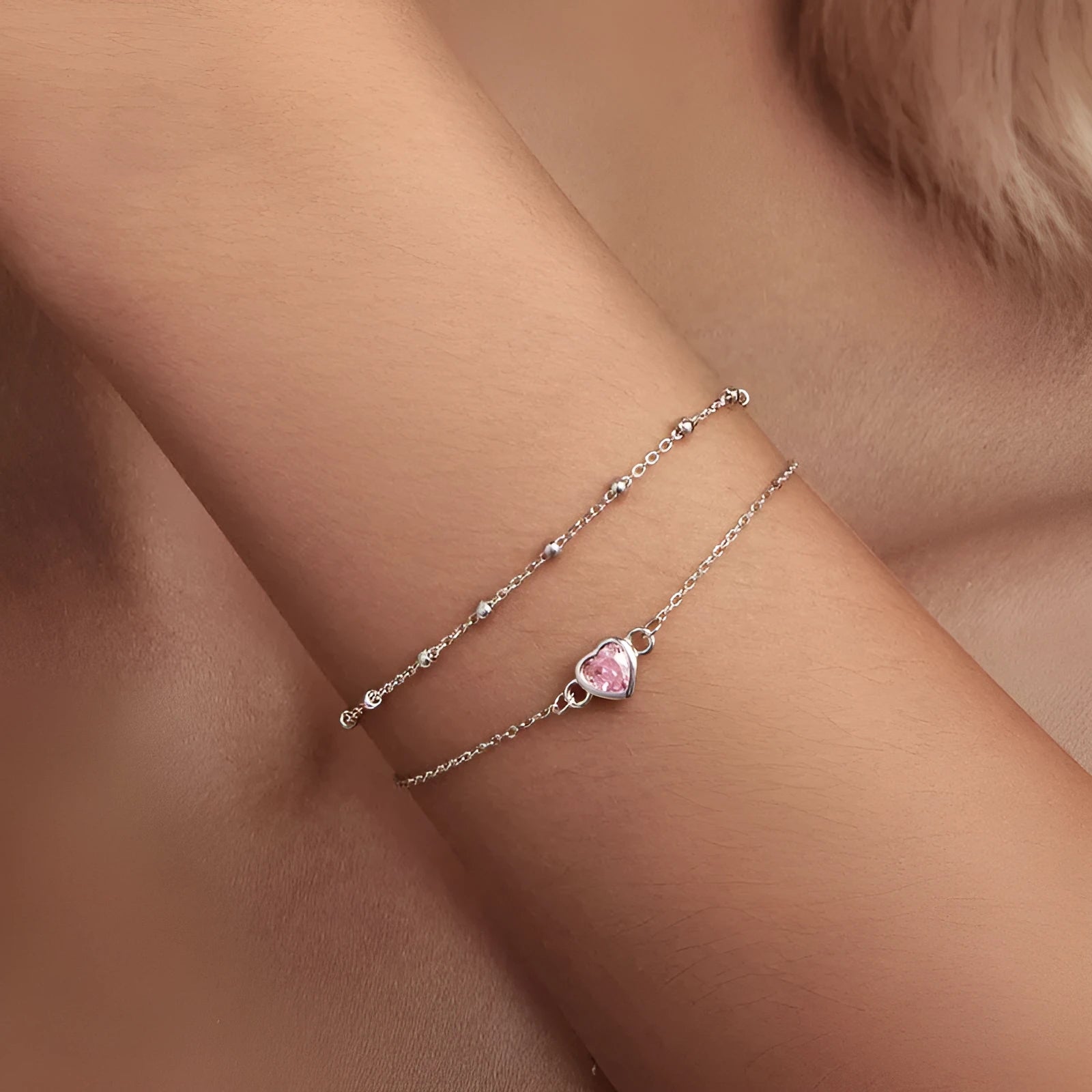 Women's 925 sterling silver bracelet with small heart-shaped pendant on an adjustable chain.