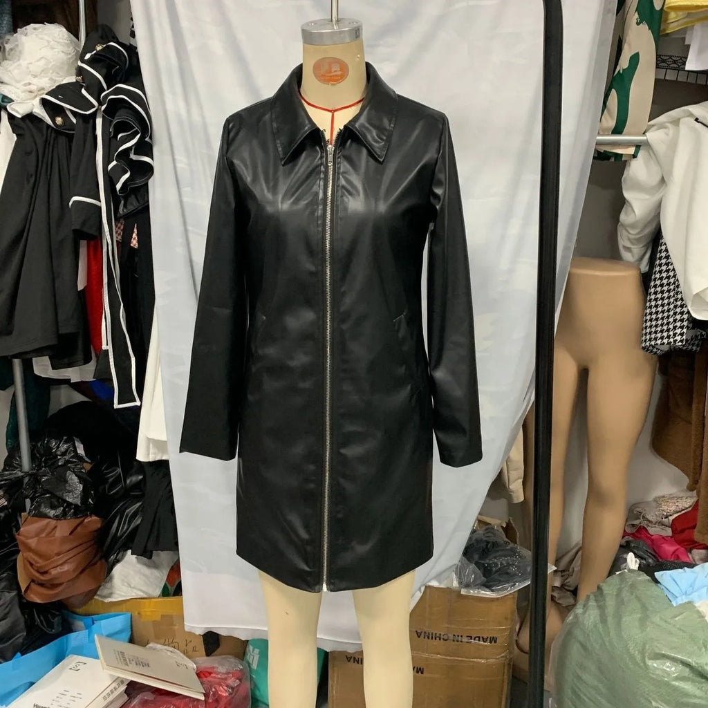 Black women's medium-length polyester jacket with long sleeves on a hanger.