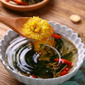 Box of honeysuckle chrysanthemum herbal tea bags showing 150g net weight and bundle options
