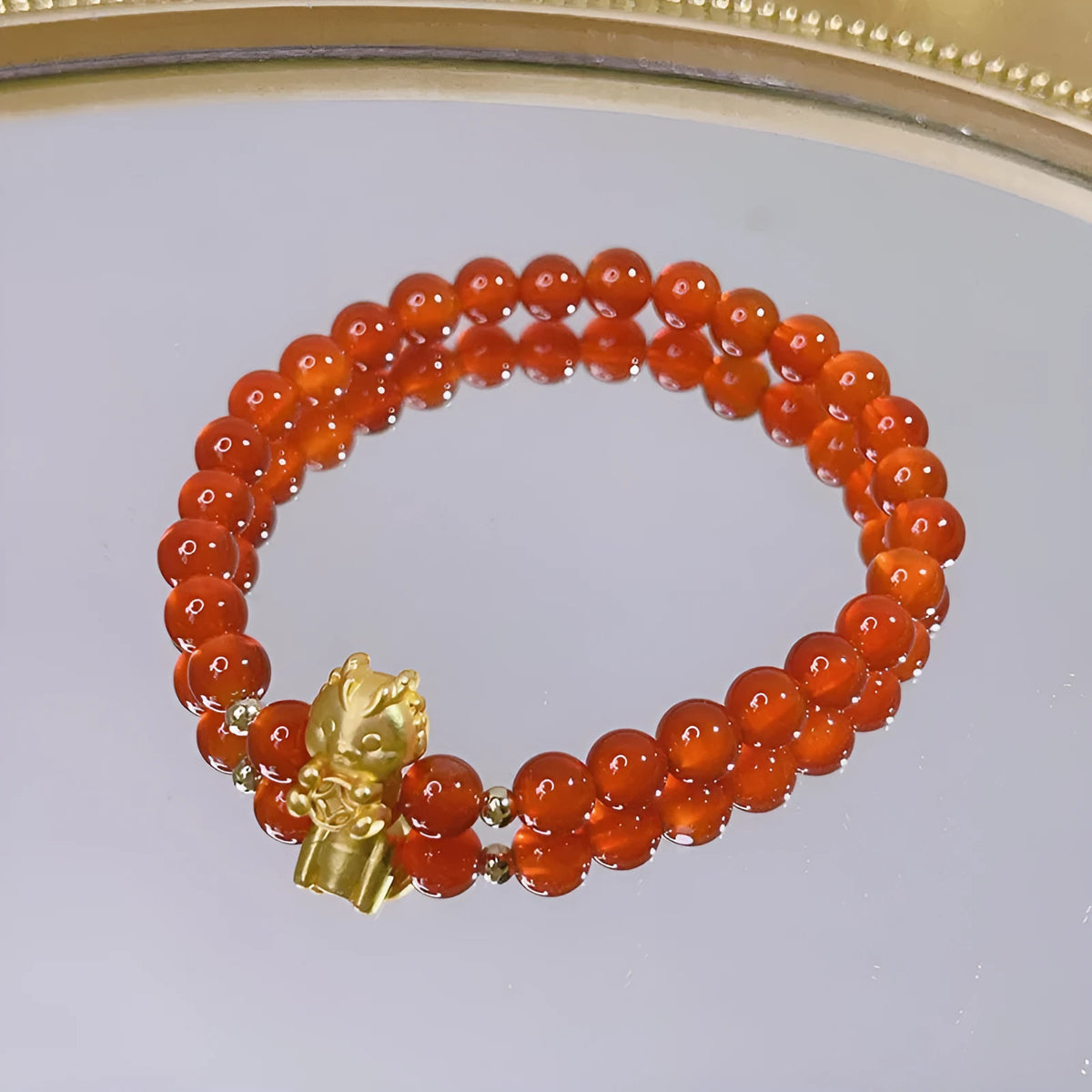 Handmade red agate bracelet with dragon motif for women, Chinese style.