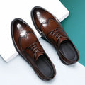 Men's black and brown brogue leather business shoes with traditional perforated detailing