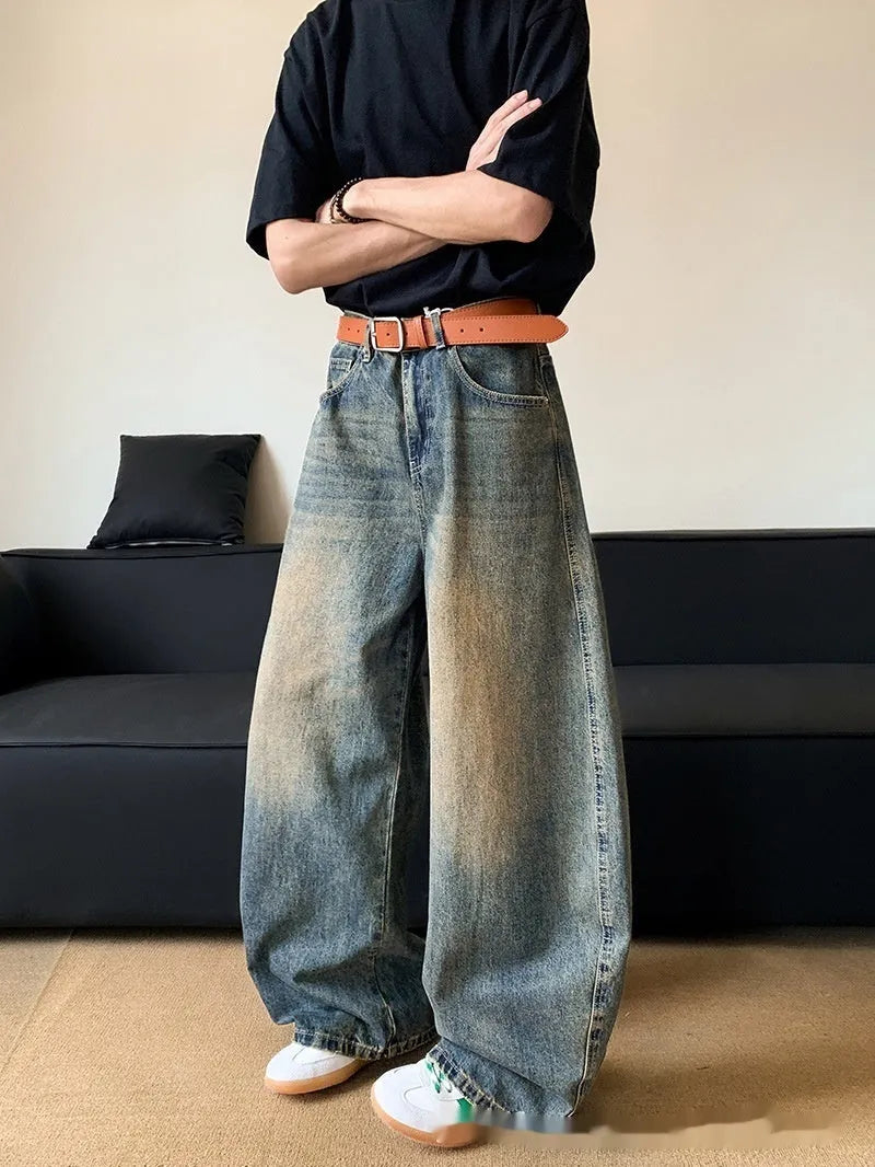 Men's retro blue distressed denim jeans with wide-leg trouser design and micro-elastic fabric
