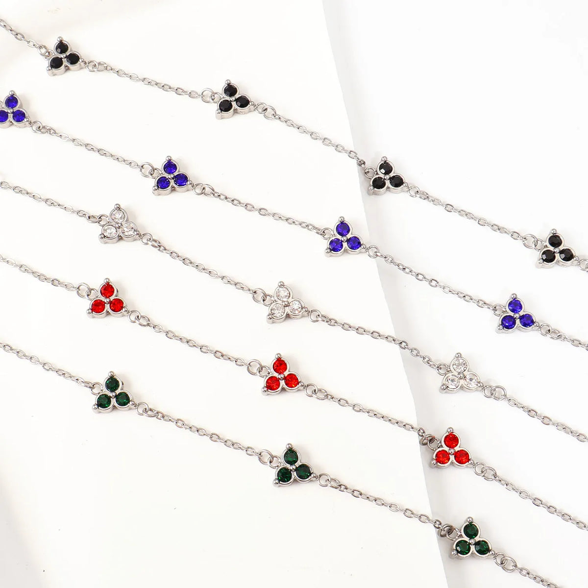 Women's geometric stainless steel bracelet with three-diamond triangle design and zircon stones
