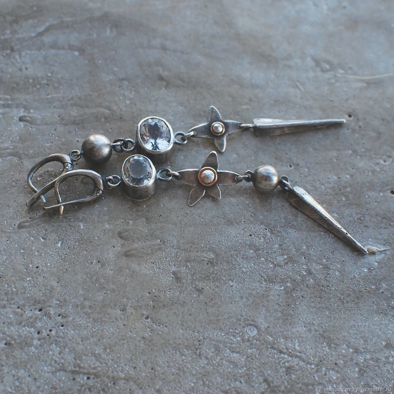 Long geometric XINGX design pendant earrings in antique silver tone with rhinestones.
