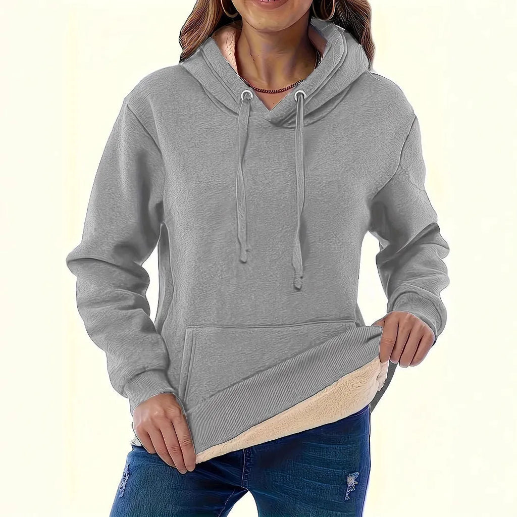 Women's thick polyester hooded sweater with pockets in loose fit
