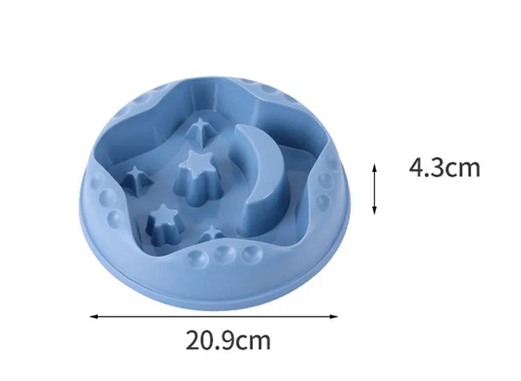 Blue plastic slow feeder dog bowl with moon, star, and wing-shaped interior ridges