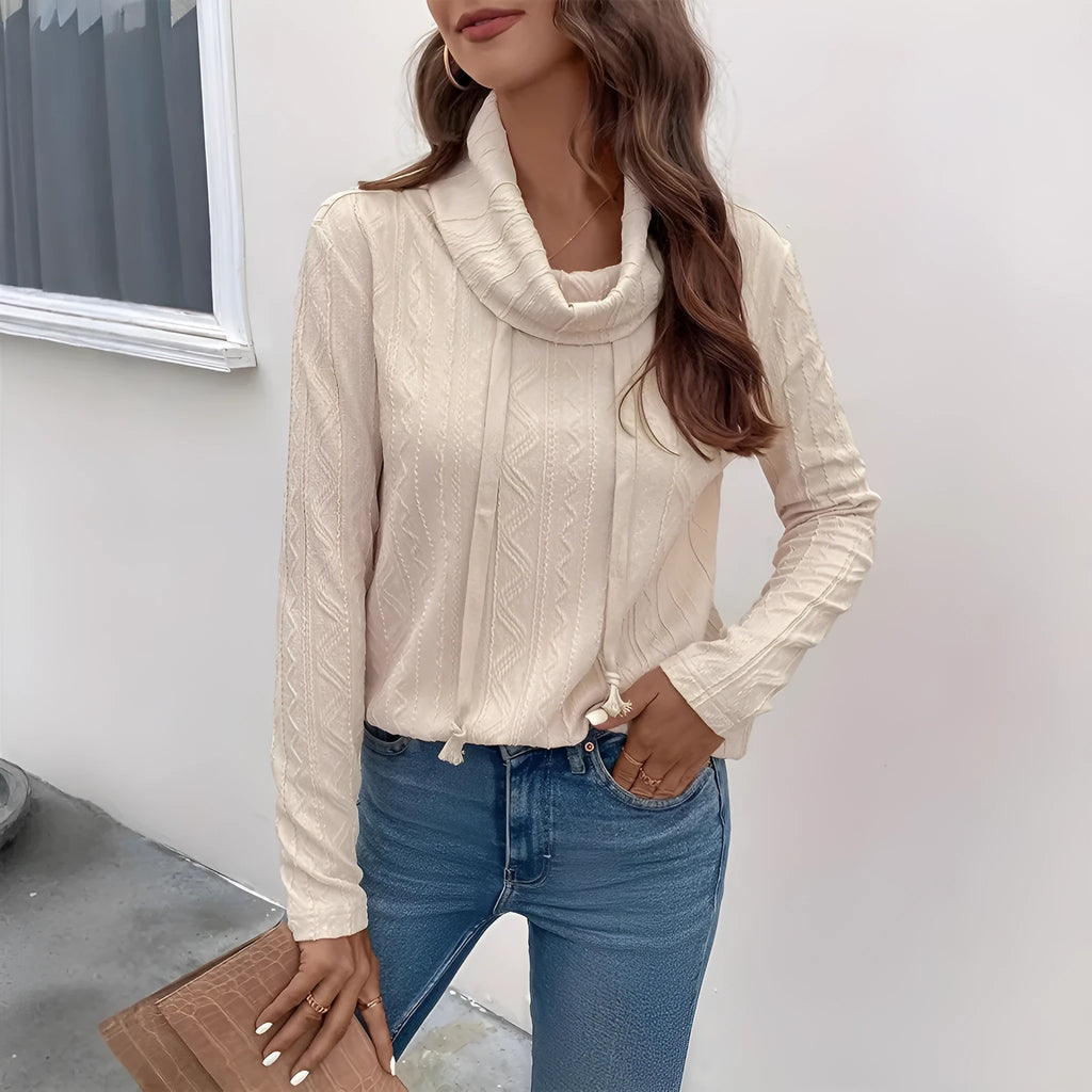 Apricot hooded pullover sweater with drawstring and long sleeves on a mannequin